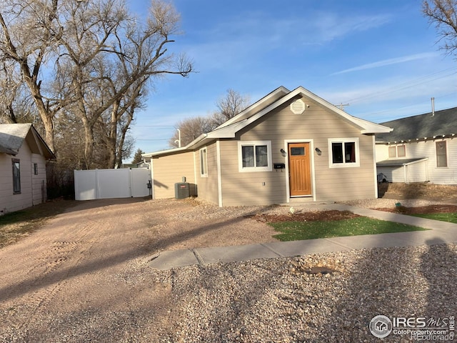 210 S Bowman Ave, Holyoke, CO 80734 - view of front facade with fence and cooling unit