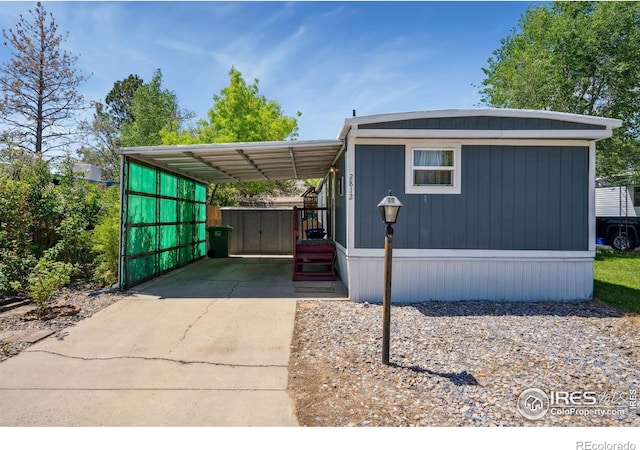 2812 Mango Pl, Loveland, CO 80537 - manufactured / mobile home featuring concrete driveway and a carport