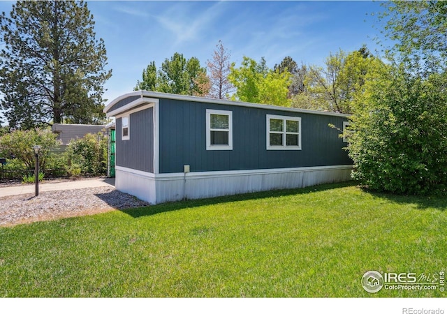 2812 Mango Pl, Loveland, CO 80537 - view of side of home featuring a yard