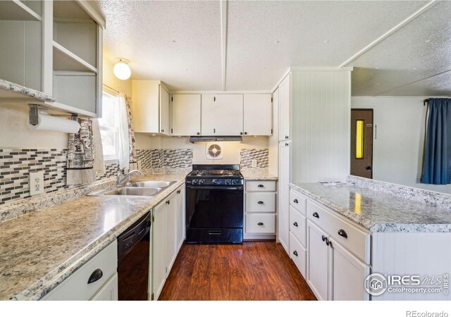 2812 Mango Pl, Loveland, CO 80537 - kitchen with black appliances, a sink, dark wood finished floors, open shelves, and a textured ceiling