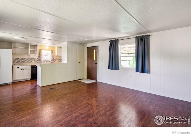 2812 Mango Pl, Loveland, CO 80537 - unfurnished living room with wood finished floors and a textured ceiling