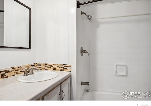 2812 Mango Pl, Loveland, CO 80537 - full bath featuring decorative backsplash, vanity, and bathtub / shower combination