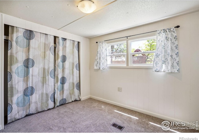 2812 Mango Pl, Loveland, CO 80537 - carpeted empty room with a textured ceiling and baseboards