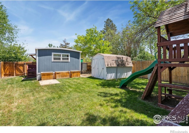 2812 Mango Pl, Loveland, CO 80537 - view of yard featuring a storage unit, an outdoor structure, and a playground