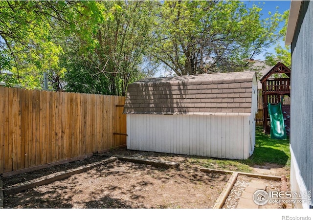 2812 Mango Pl, Loveland, CO 80537 - gate with a shed, a fenced backyard, and an outbuilding