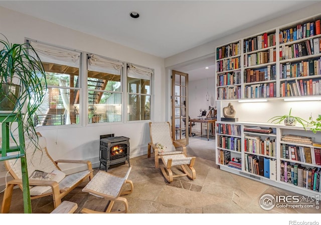 435 Quartz Way, Lyons, CO 80540 - sitting room featuring a wood stove and recessed lighting