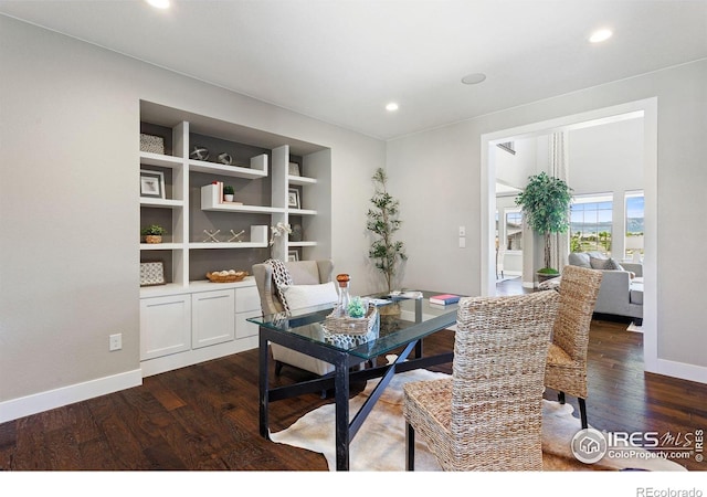 16069 Pikes Peak Dr, Broomfield, CO 80023 - dining space with dark wood-style flooring, baseboards, a desk, recessed lighting, and built in shelves