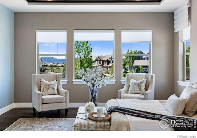16069 Pikes Peak Dr, Broomfield, CO 80023 - bedroom featuring multiple windows, dark wood-style floors, and baseboards