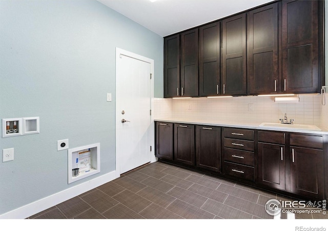 16069 Pikes Peak Dr, Broomfield, CO 80023 - laundry room featuring washer hookup, cabinet space, hookup for an electric dryer, and baseboards