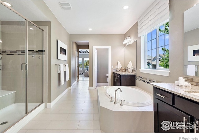 16069 Pikes Peak Dr, Broomfield, CO 80023 - full bathroom with a stall shower, toilet, a bath, healthy amount of natural light, and recessed lighting