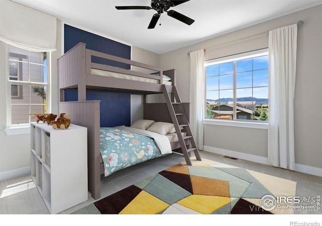 16069 Pikes Peak Dr, Broomfield, CO 80023 - carpeted bedroom with baseboards and a ceiling fan