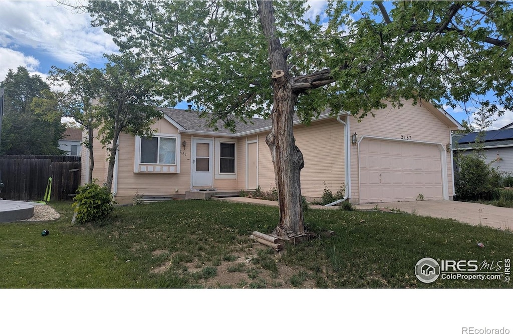 view of front of home featuring driveway and a garage
