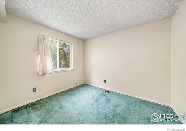 2167 Hackberry Cir, Longmont, CO 80501 - carpeted empty room featuring a textured ceiling and baseboards