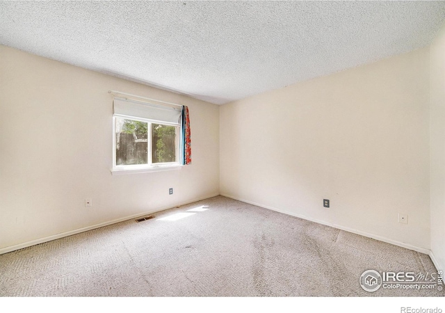 2167 Hackberry Cir, Longmont, CO 80501 - unfurnished room featuring carpet, a textured ceiling, and baseboards