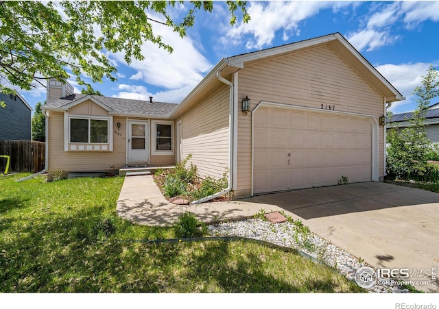2167 Hackberry Cir, Longmont, CO 80501 - single story home featuring a chimney, an attached garage, and driveway