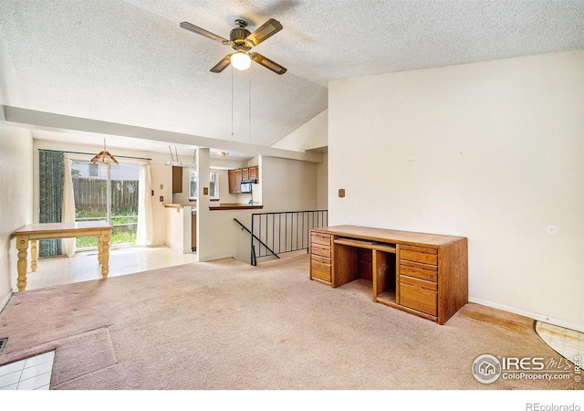 2167 Hackberry Cir, Longmont, CO 80501 - unfurnished office with light carpet, a textured ceiling, ceiling fan, lofted ceiling, and baseboards