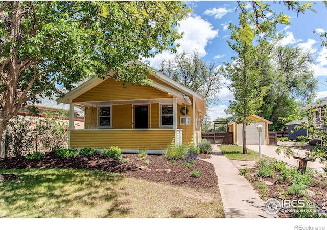 628 Endicott St, Fort Collins, CO 80524 - view of front of home featuring covered porch and an outbuilding