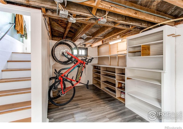 628 Endicott St, Fort Collins, CO 80524 - basement featuring wood finished floors and stairway