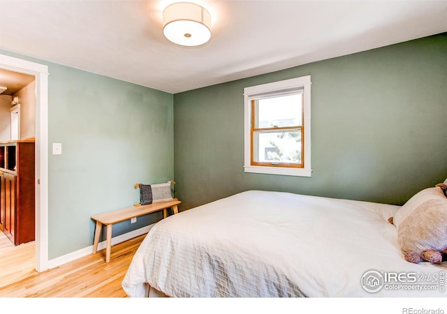 628 Endicott St, Fort Collins, CO 80524 - bedroom featuring wood finished floors and baseboards