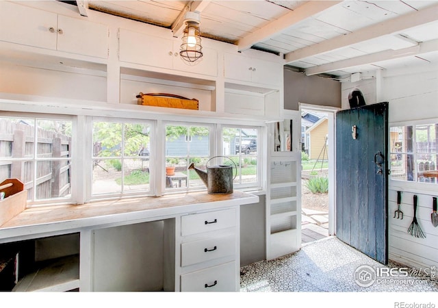 628 Endicott St, Fort Collins, CO 80524 - home office with light floors, beam ceiling, and wooden ceiling
