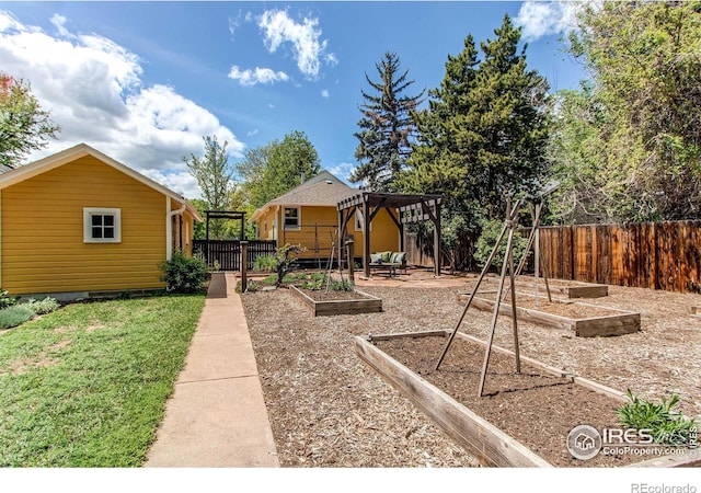 628 Endicott St, Fort Collins, CO 80524 - fenced backyard featuring a garden and a pergola