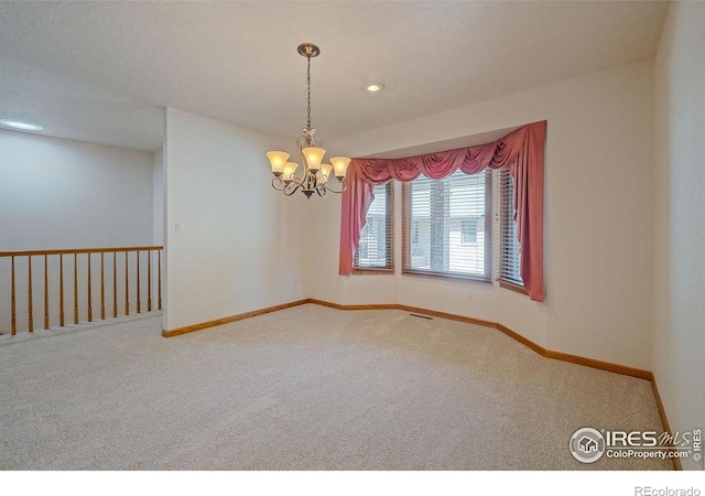 unfurnished room with carpet, a chandelier, baseboards, and recessed lighting
