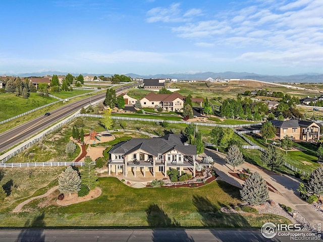 view of property location with nearby suburban area and mountains