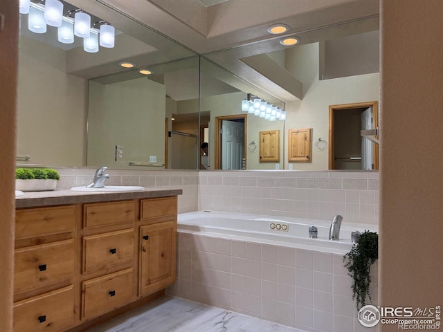 full bath featuring a bath, vanity, and a shower with shower door