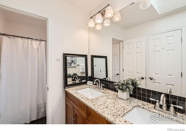 full bathroom featuring decorative backsplash and double vanity