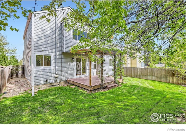 back of property with a wooden deck