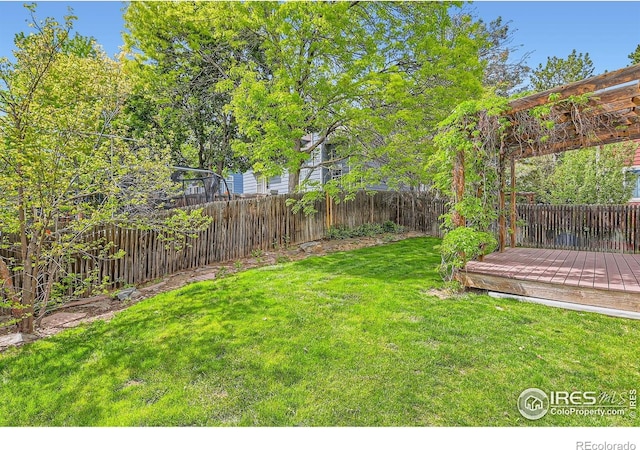 view of yard with a wooden deck