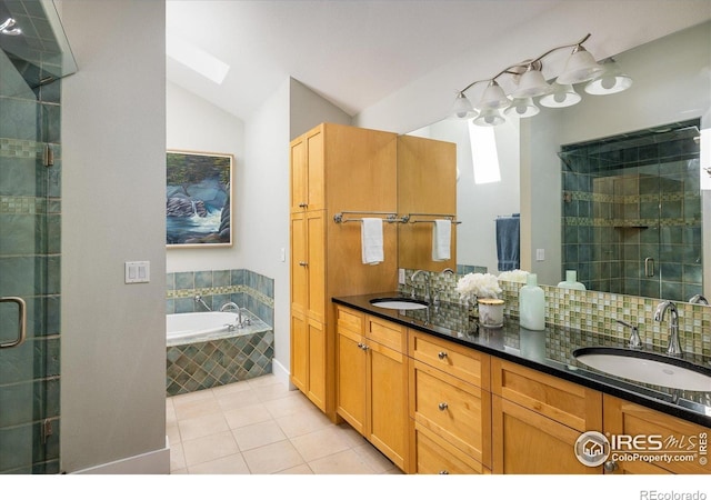5523 Stonewall Pl, Boulder, CO 80303 - bathroom with a stall shower, a skylight, tile patterned floors, double vanity, and lofted ceiling