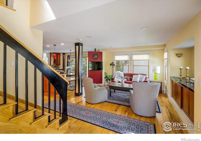 5523 Stonewall Pl, Boulder, CO 80303 - living room with light wood-style floors, stairway, recessed lighting, and baseboards