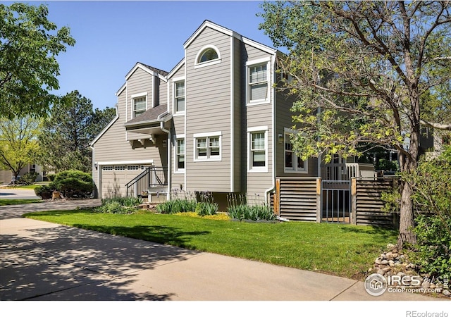 5523 Stonewall Pl, Boulder, CO 80303 - multi unit property with concrete driveway, stairs, a garage, and a front lawn