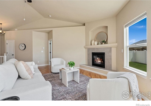 3933 Mount Hope St, Wellington, CO 80549 - living area featuring a fireplace, wood finished floors, and lofted ceiling