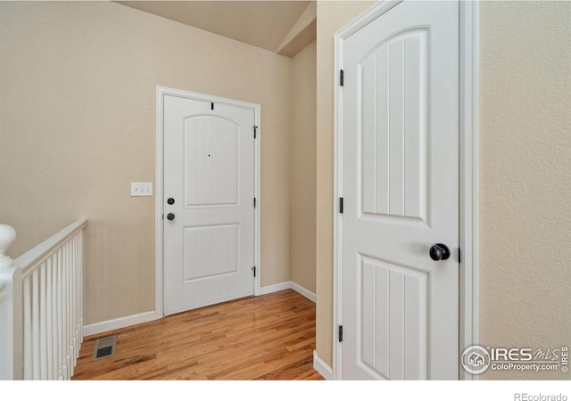3933 Mount Hope St, Wellington, CO 80549 - foyer entrance with light wood-style flooring and baseboards