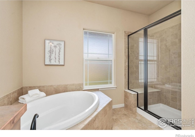 3933 Mount Hope St, Wellington, CO 80549 - bathroom with a shower stall, a garden tub, and tile patterned flooring