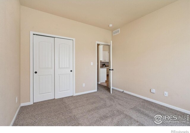 3933 Mount Hope St, Wellington, CO 80549 - unfurnished bedroom featuring carpet flooring, baseboards, and a closet