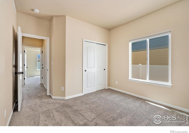 3933 Mount Hope St, Wellington, CO 80549 - unfurnished bedroom featuring carpet floors, baseboards, and a closet