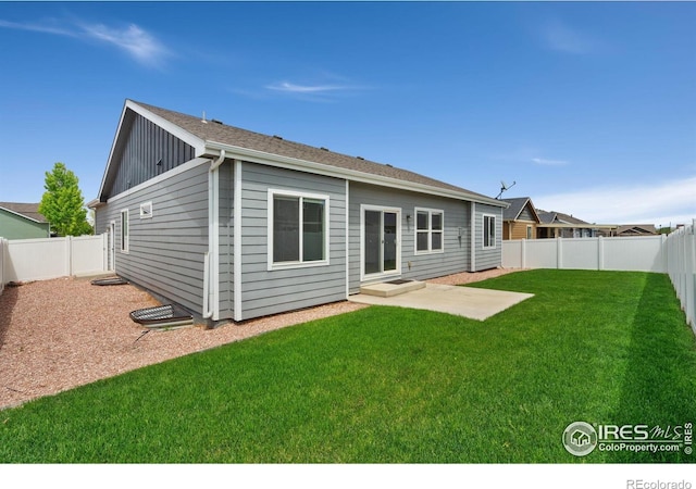3933 Mount Hope St, Wellington, CO 80549 - rear view of property with board and batten siding
