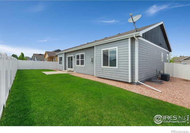 3933 Mount Hope St, Wellington, CO 80549 - rear view of house with central air condition unit and board and batten siding
