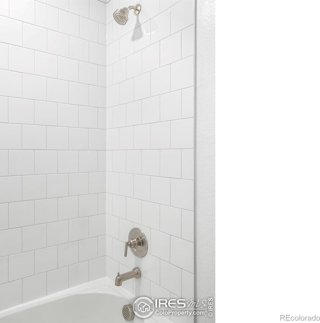 bathroom with shower / bath combination