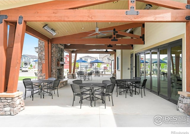 view of patio featuring outdoor dining space and ceiling fan