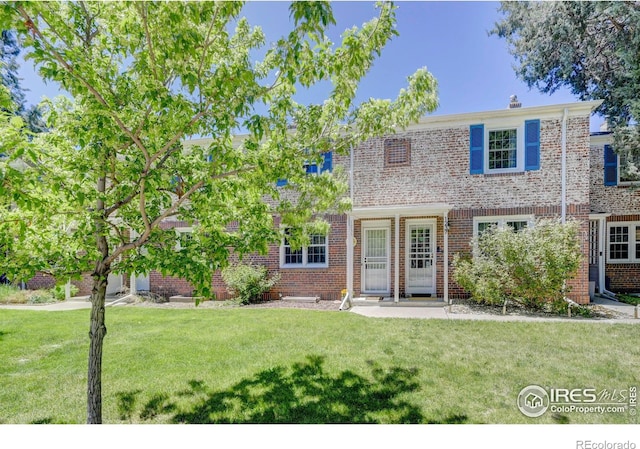 1235 Leyden St, Denver, CO 80220 - multi unit property featuring a front yard and brick siding