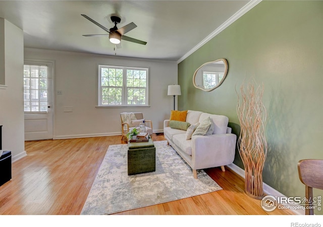1235 Leyden St, Denver, CO 80220 - living area with ceiling fan, crown molding, wood finished floors, and baseboards