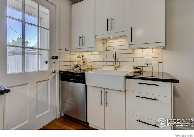 1235 Leyden St, Denver, CO 80220 - kitchen featuring dishwasher, a sink, decorative backsplash, and white cabinetry