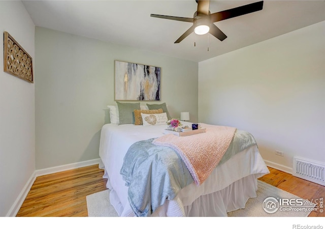 1235 Leyden St, Denver, CO 80220 - bedroom with wood finished floors, baseboards, and ceiling fan
