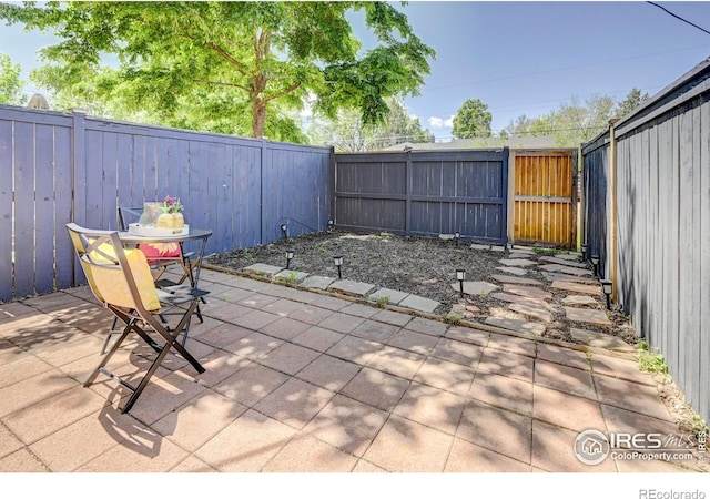 1235 Leyden St, Denver, CO 80220 - view of patio with a fenced backyard