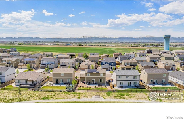 aerial perspective of suburban area featuring a mountain backdrop