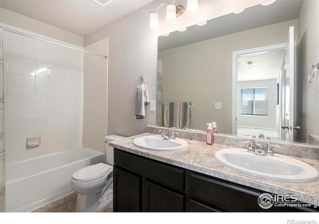 bathroom with toilet, double vanity, and shower / tub combination